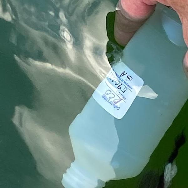 P sampling bottle in water